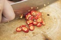 Sliced Ã¢â¬â¹Ã¢â¬â¹red peppers on a wood chopping board Royalty Free Stock Photo